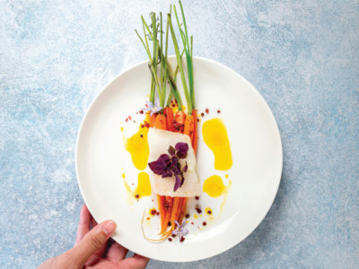 White cod cooked at a low temperature, young carrots glazed with ginger and pink peppercorns